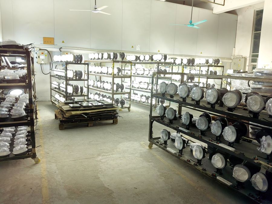 LED dusk to dawn lights on aging test racks in the LOWCLED factory LED dusk to dawn lights on aging test racks in the LOWCLED factory