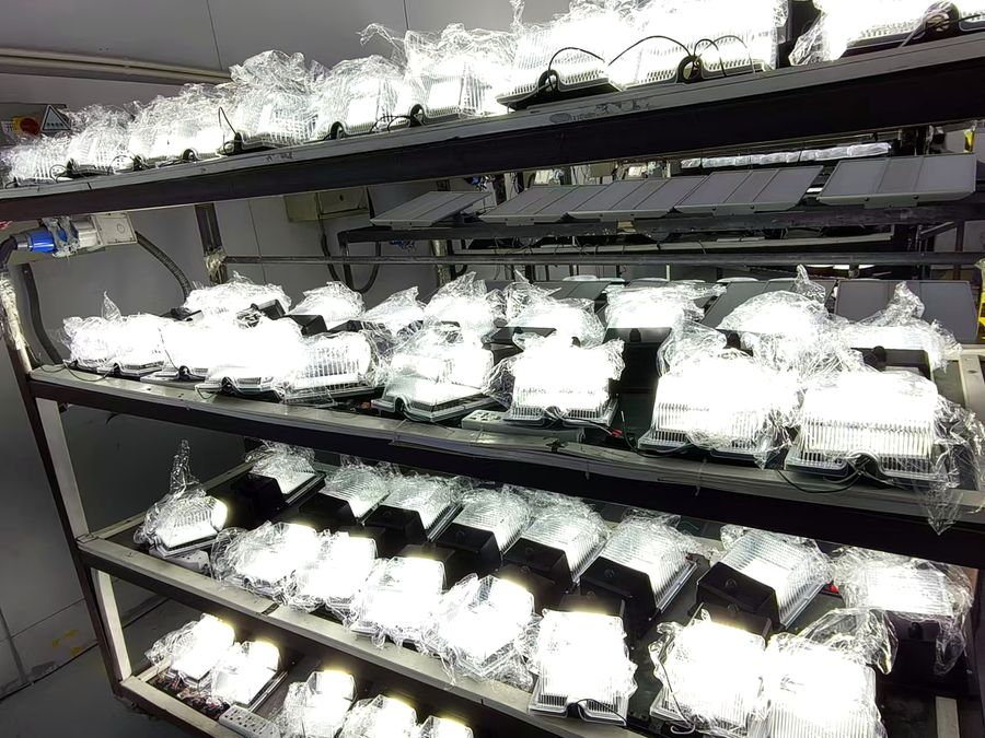 LED wall pack lights on aging test racks in the LOWCLED factory LED wall pack lights on aging test racks in the LOWCLED factory